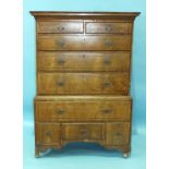 An 18th century walnut chest on stand, the moulded cornice above two short and three long drawers,