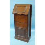 An unusual walnut marine bulkhead fold-away wash stand, the rising lid fitted with a mirror and
