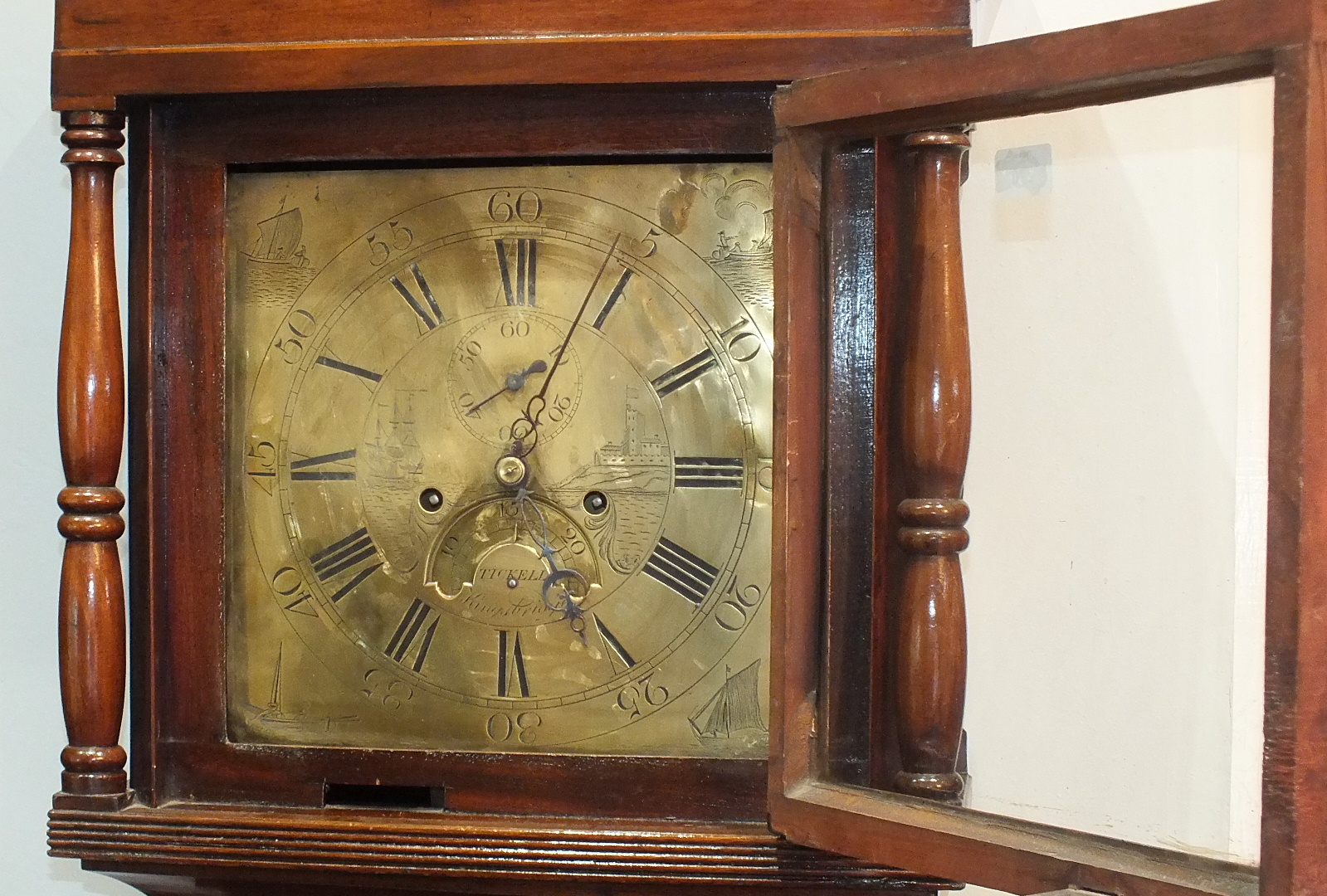 Charles Tickell, Kingsbridge, an inlaid mahogany long case clock, the 12'' brass dial with second