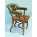 A late-19th century mahogany library chair, the partially-upholstered leather button back and arms