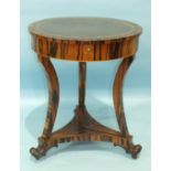 An early-19th century zebra wood centre table, the circular top with leather surface and frieze