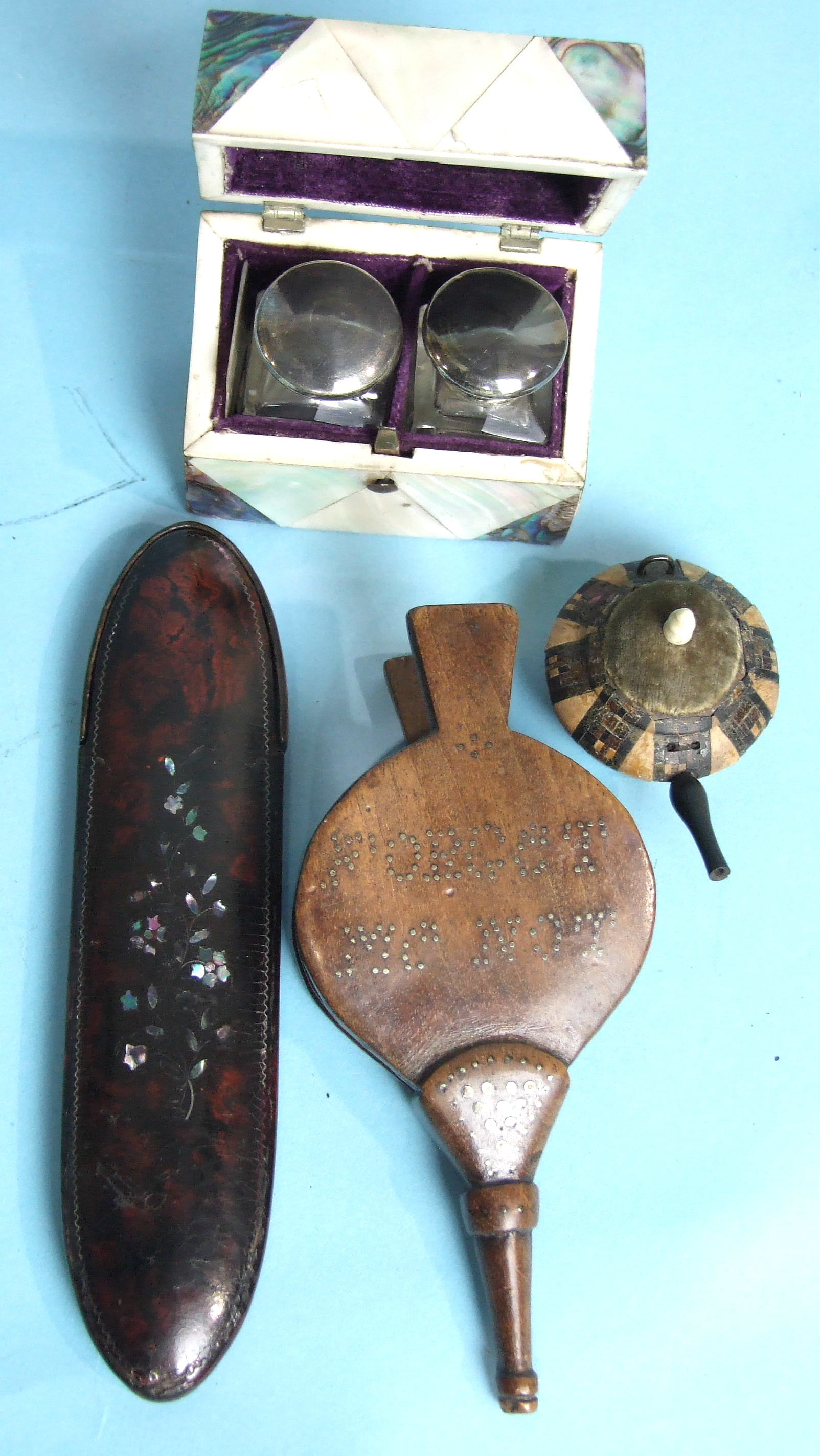 A 19th century mahogany novelty snuff box in the form of a pair of bellows, inset with brass pins