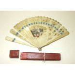 An early-19th century ivory brisé fan with plain guards, the sticks painted with gold flowers,