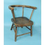 A rustic elm and beech child's chair with simple hoop back and shaped solid seat, on turned legs