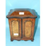 A Victorian burr walnut work box, the hinged lid revealing a fitted interior above three cross-