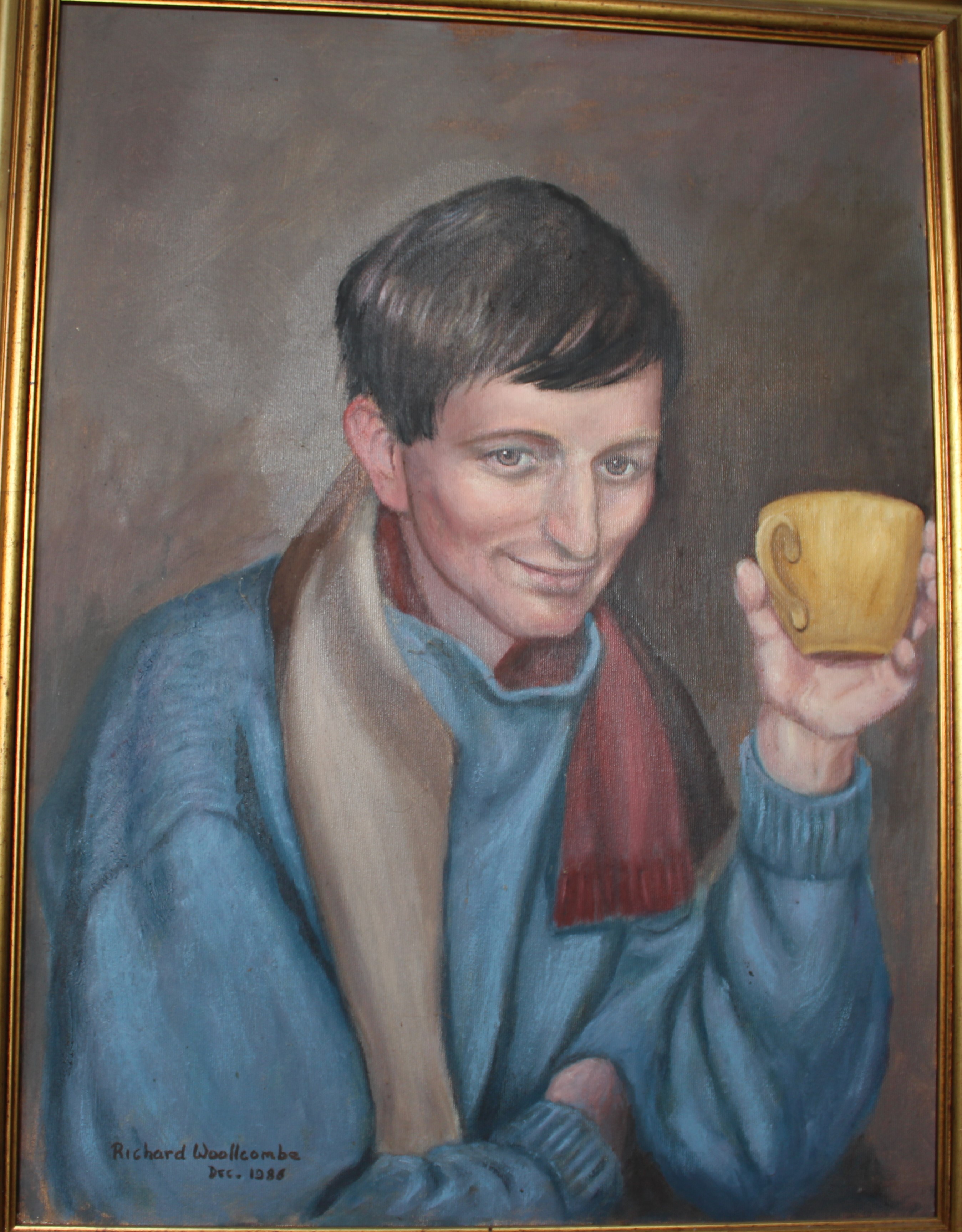 •PORTRAIT OF GRAHAM WOOLLCOMBE WEARING A RED SCARF AND HOLDING A YELLOW TEA CUP Signed framed oil on