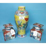 A pair of 19th century Japanese Imari square bottles and stoppers and a Chinese baluster vase with a