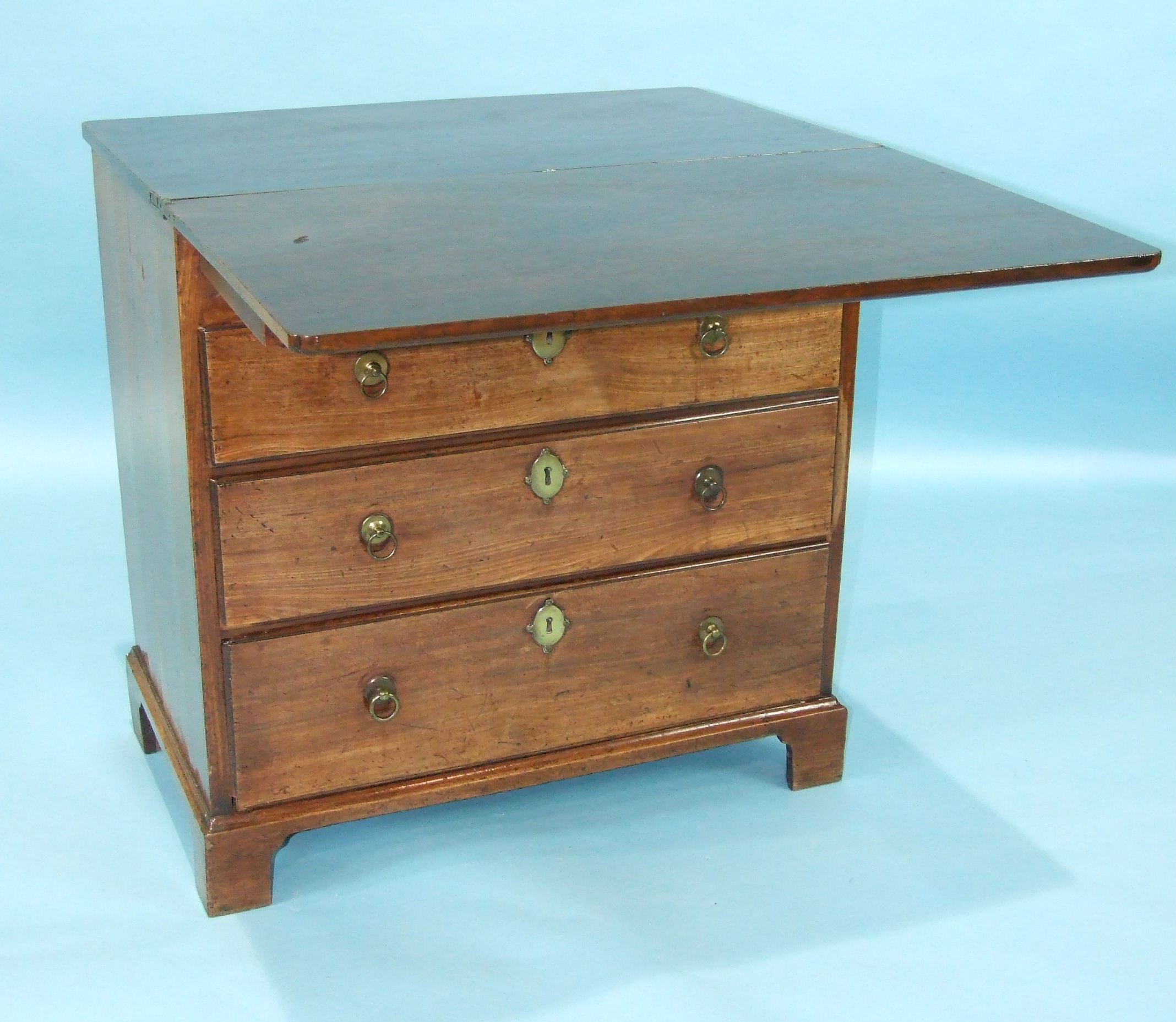A Georgian mahogany bachelor's chest, the fold-over top above two short and three long moulded - Image 2 of 2