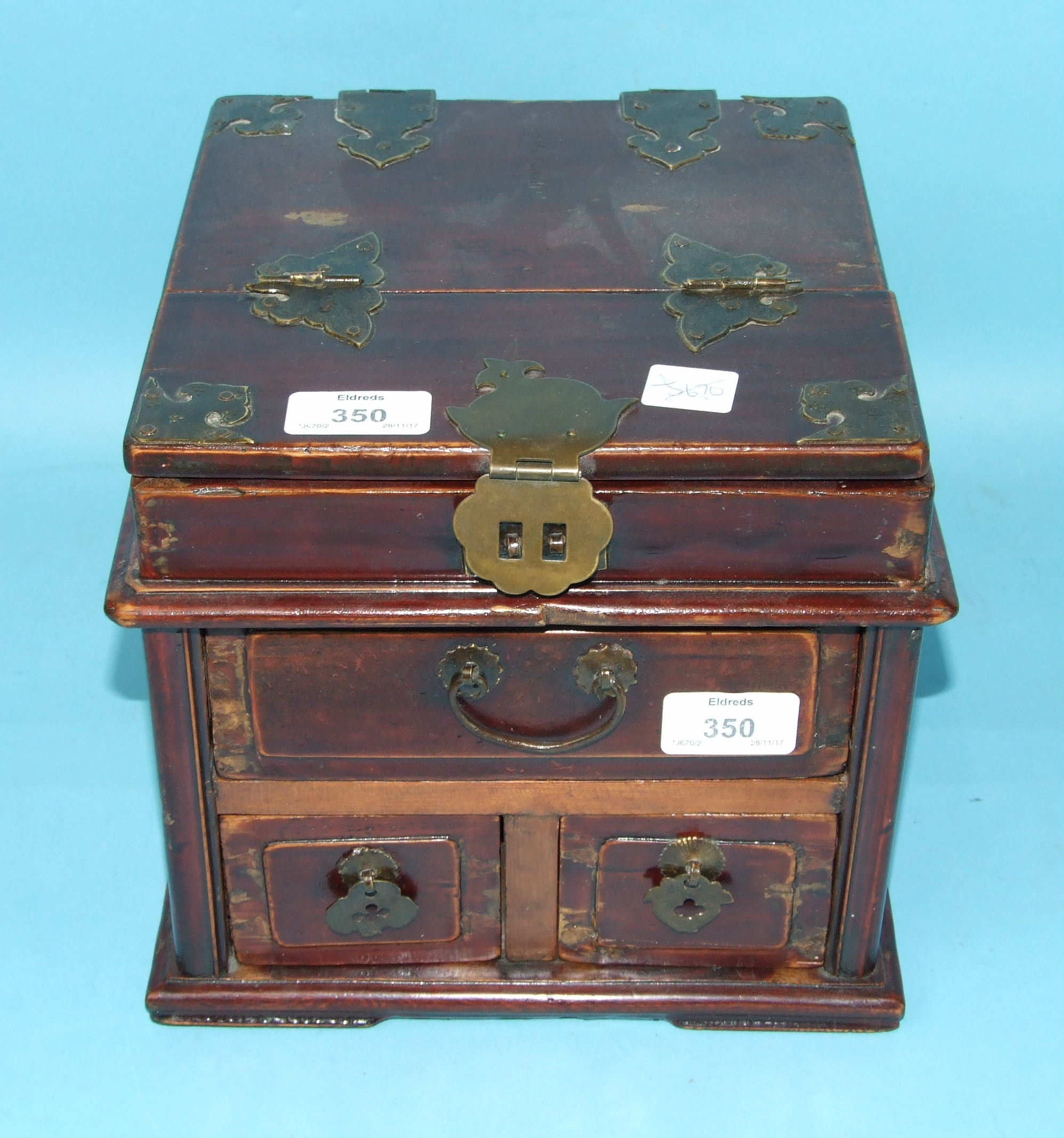 A 19th century Oriental lacquered wood jewellery box, the hinged top concealing a folding mirror