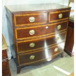 A Georgian mahogany and satinwood-banded bow-fronted chest of two short and three long drawers, on