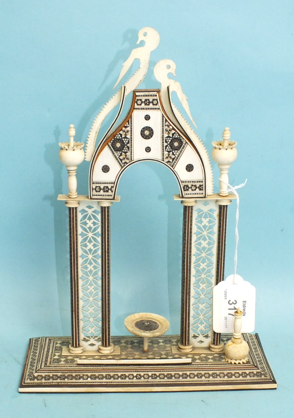 A Vizagapatam watch holder in the form of an arch, 26cm high.