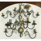 A brass two-tier 12-branch chandelier, 67cm high, 55cm diameter.