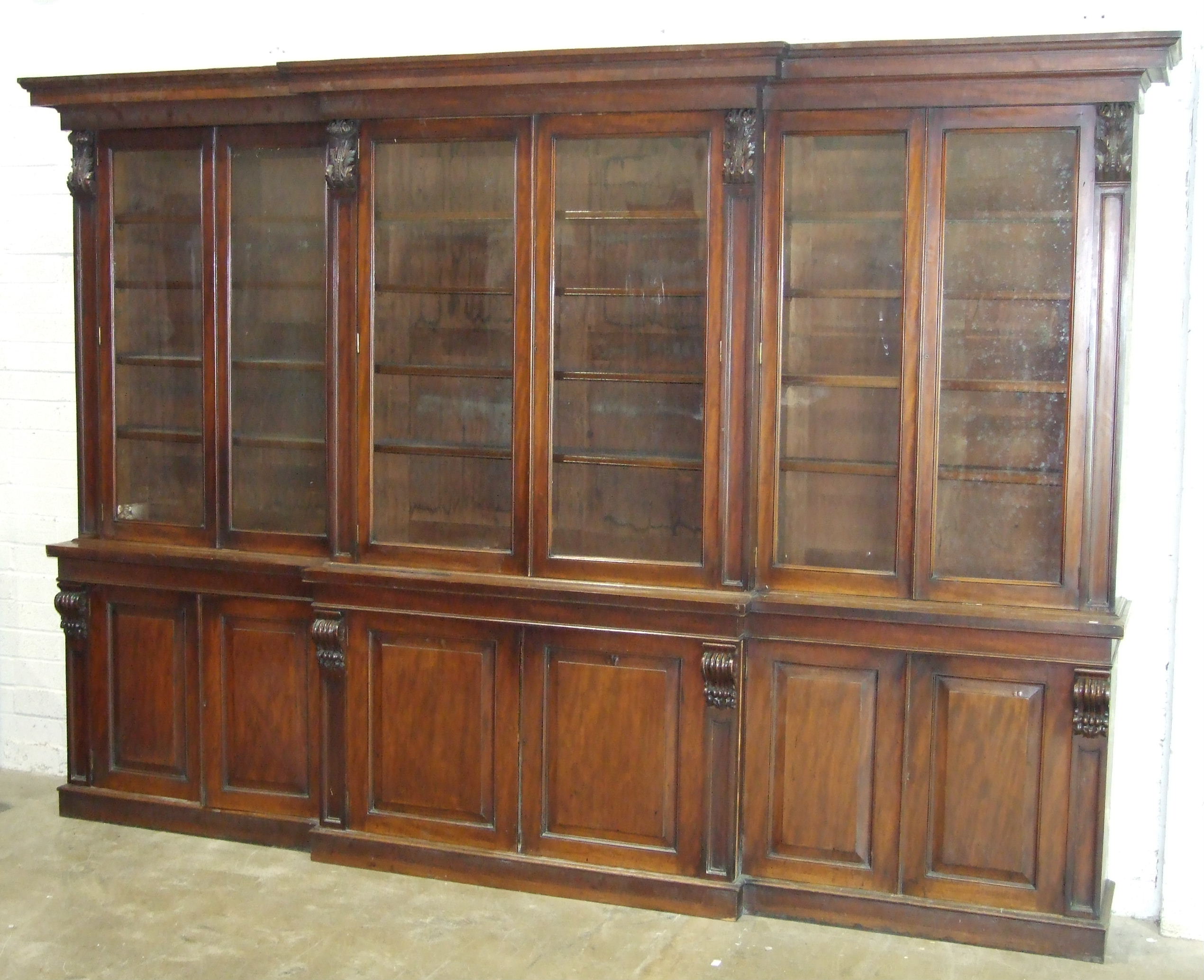 A large Victorian mahogany breakfront bookcase, the moulded stepped cornice supported by carved - Image 3 of 3