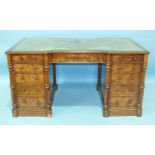 A good quality Victorian walnut knee-hole writing desk, the rectangular top on inverted breakfront