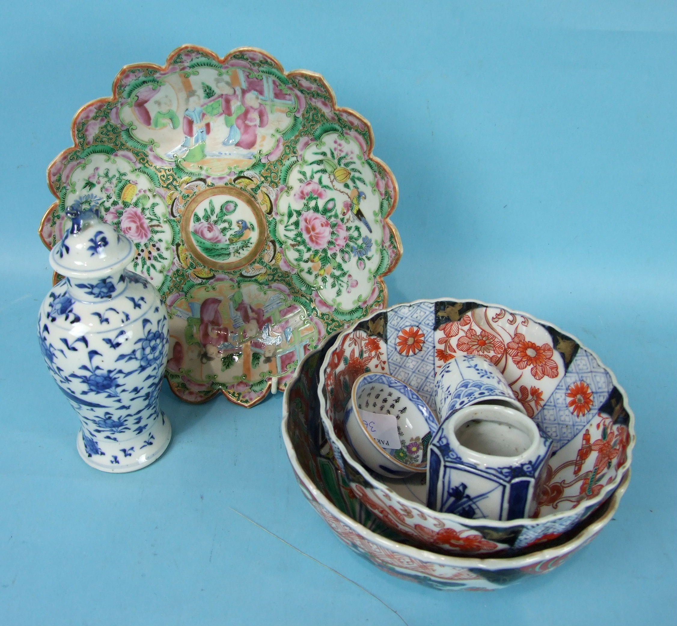 A 19th century Chinese Canton shaped circular dish, a small blue and white vase and cover, two