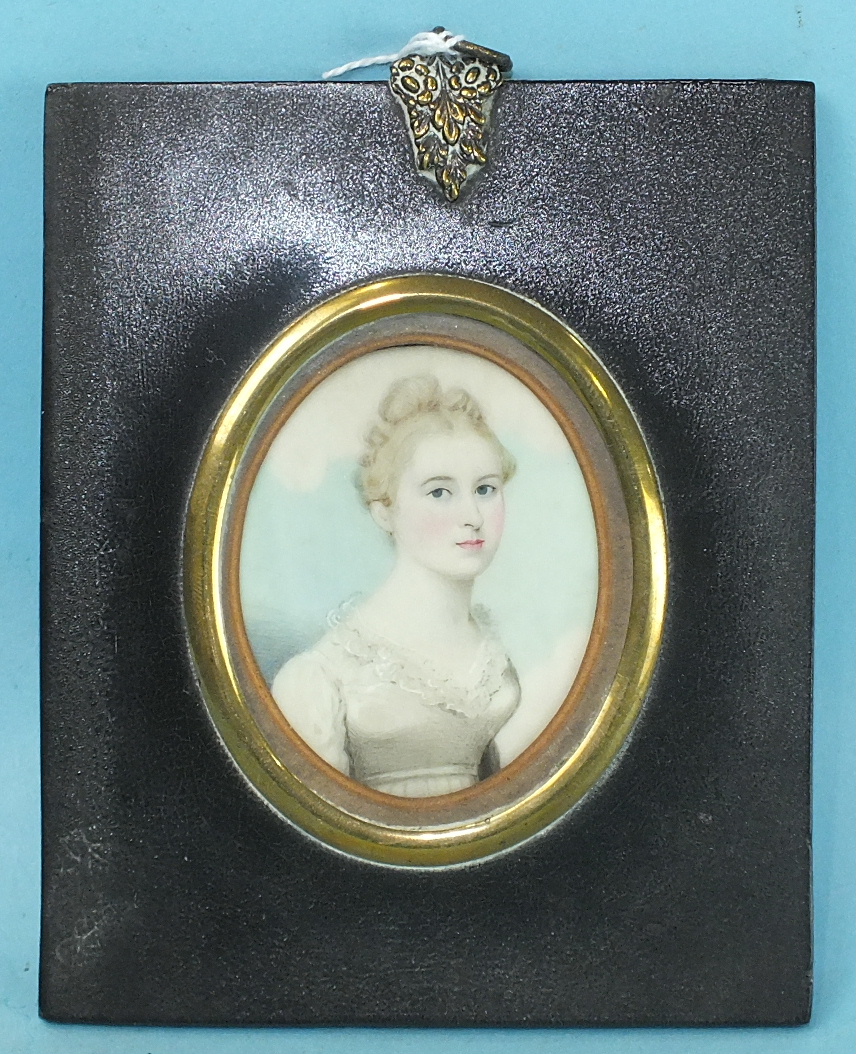 19th century, an oval miniature portrait of a young lady wearing a white lace-trimmed dress,