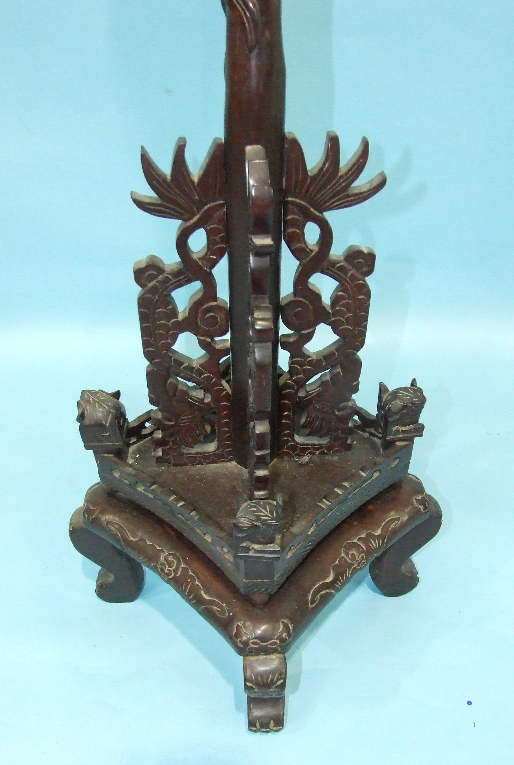 A 20th century Chinese carved hardwood lamp standard, the column carved with dragons to a square - Image 2 of 3