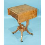 An early-19th century maple-veneered work table, the rectangular top with two drop leaves above