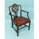 An 18th century Hepplewhite-style mahogany carver chair, the pierced vase splat carved with drapery,