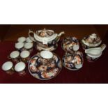 An early-19th century English porcelain Imari pattern part tea service, thirty pieces.