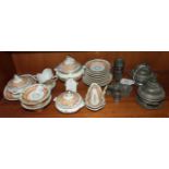 A 19th century porcelain part tea service for a doll together with a pair of pewter tureens and