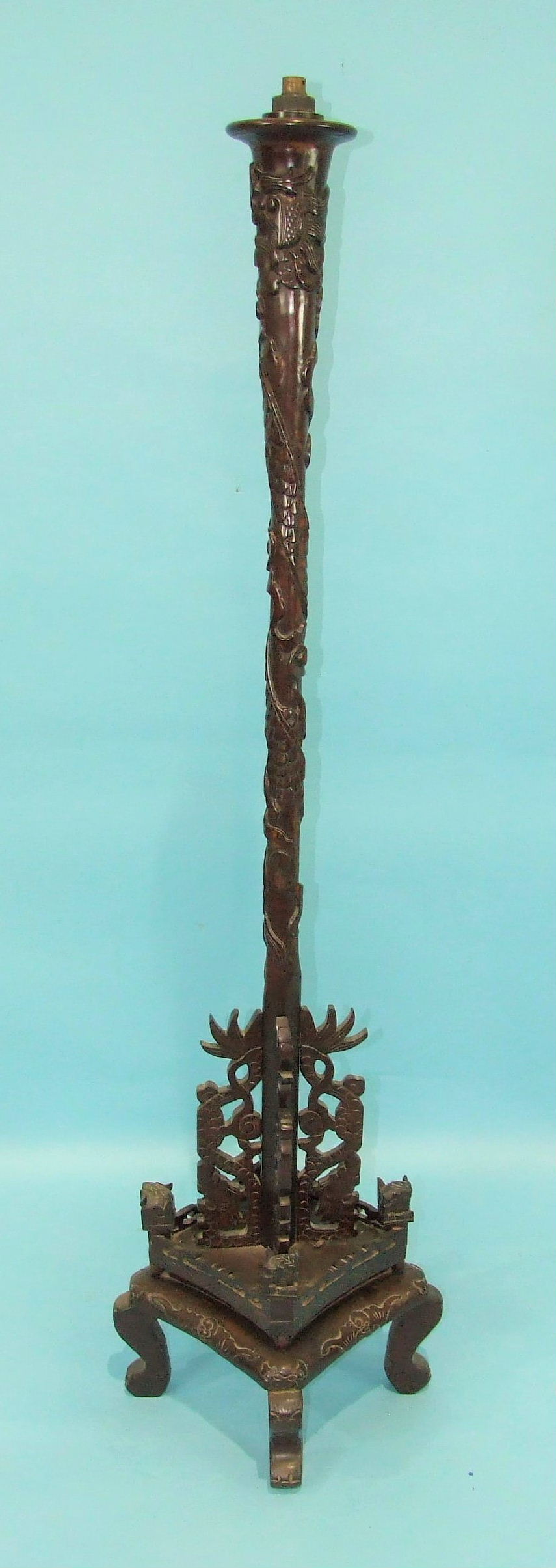 A 20th century Chinese carved hardwood lamp standard, the column carved with dragons to a square