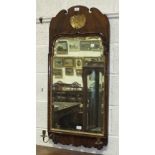 An 18th century parcel gilt walnut girandole with shaped rectangular mirror plate, a pair of brass