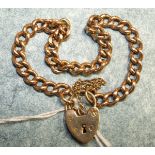A 9ct gold curb link bracelet with padlock clasp, 15.7g.