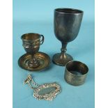 An engine turned silver napkin ring, Birmingham 1919, two small silver trophy cups and a pin tray,