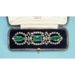 A 20th century paste brooch set three green paste stones within wreaths of white stones in white