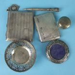 An engine-turned silver cigarette case, Birmingham 1928, a small pierced silver bonbon dish,