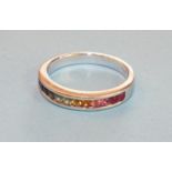 A Judy Mayfield rainbow ring, channel set twelve round cut sapphires in 14K white gold mount, size N