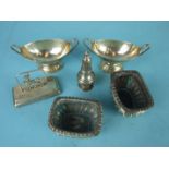 A pair of silver boat shaped salts on oval feet, London 1890 and a pair of gadrooned rectangular