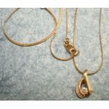 An 18ct gold pendant of tear drop form, set diamonds on 18ct gold chain, 40cm, 4.8g.