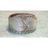 A Victorian sterling silver hinged cuff bangle having engraved and beaded decoration to represent