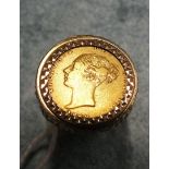 A Victoria 1869 half-sovereign in 9ct gold ring mount, 11.9g.