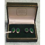 A pair of blue and green enamelled silver cufflinks, boxed.