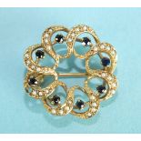 A small wreath brooch set eight round cut sapphires in 9ct gold mount set seed pearls (one pearl