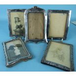 An Art Nouveau style silver picture frame, Birmingham 1918 and four other small picture frames, (