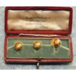 A cased set of three 18ct yellow gold dress studs set pearls, 3.8g in Boodle & Dunthorne box.