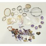 Seven loose amethysts in gilt metal mounts, other loose gem stones, carved mother of pearl counters,