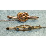 An Edwardian 9ct gold brooch set blue topaz and pearl and an unmarked knot brooch, total weight 5.