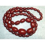 A string of Bakelite amber-style graduated beads, 87cm.