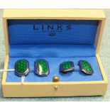 Links of London, a pair of enamelled silver cufflinks,, each with fleur de lys motifs on green