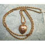 A 9ct rose gold heart shaped pendant set diamond point on 9k gold rope twist neck chain, 9.7g.