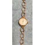 Accurist, a ladies wrist watch, the round dial with baton numerals, in 9ct gold case, with 9ct