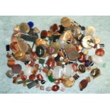 A quantity of agate and other hardstone clasps, plaques, etc.