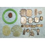 Two pierced and carved jade pendants, a green glass bangle and various oriental items of