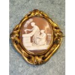 A Victorian shell cameo depicting an allegorical scene, in gilt metal swivel brooch mount with