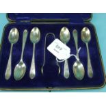 A cased set of six silver teaspoons and tongs, Sheffield 1910, ___2.4oz.